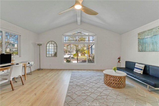 living room with lofted ceiling with beams, ceiling fan, and light hardwood / wood-style flooring