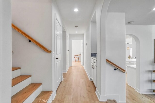 hallway with light hardwood / wood-style flooring