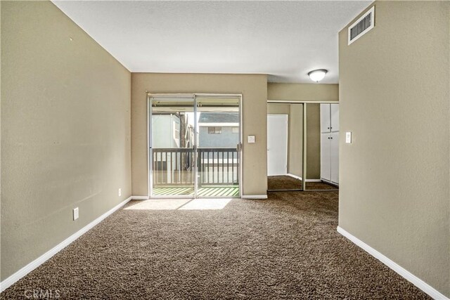 empty room featuring carpet floors