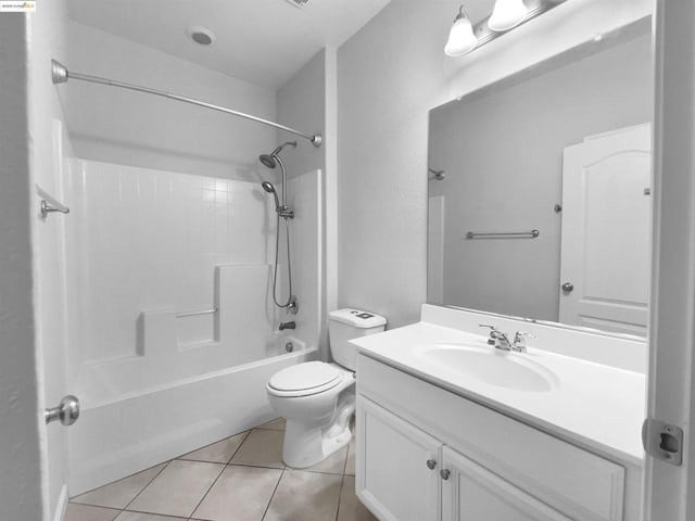 full bathroom featuring tile patterned floors,  shower combination, toilet, and vanity