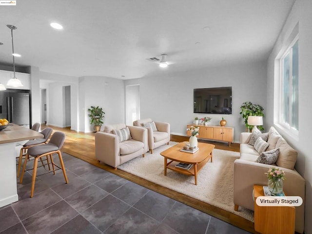 living room featuring dark tile patterned floors