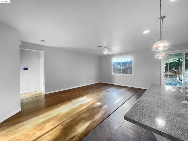 unfurnished living room featuring hardwood / wood-style flooring