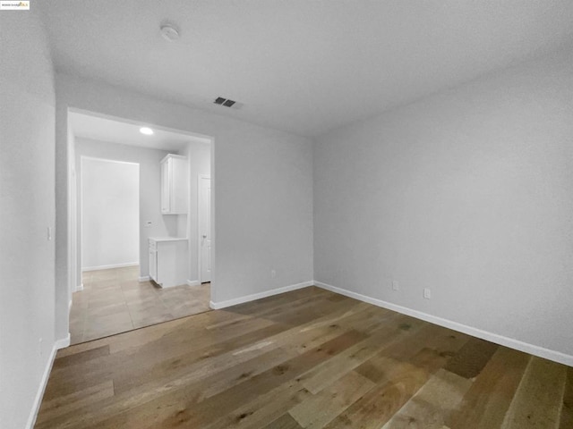 unfurnished room featuring light hardwood / wood-style flooring