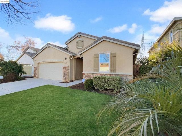 view of front facade with a garage and a front yard