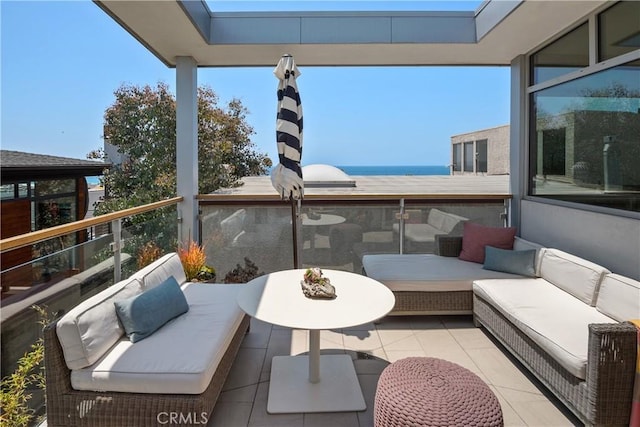 view of patio featuring outdoor lounge area and a balcony