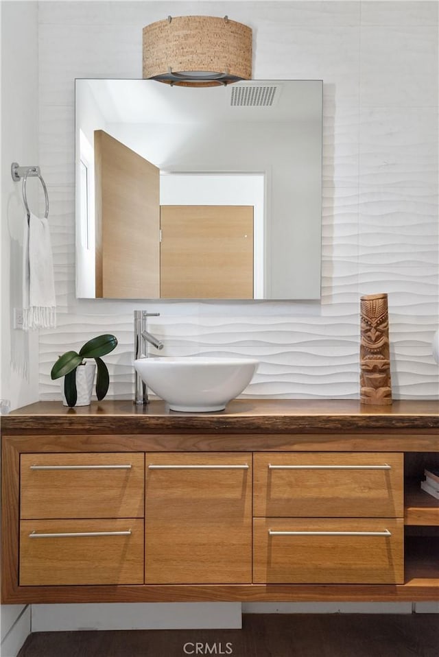 bathroom with visible vents and vanity