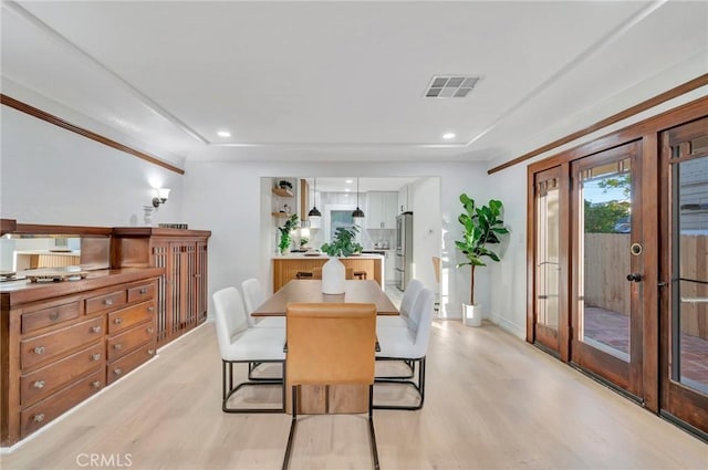 dining room with light wood-type flooring