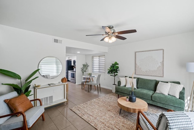 living room featuring ceiling fan