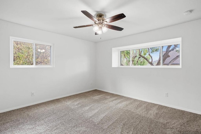 unfurnished room featuring carpet floors and ceiling fan