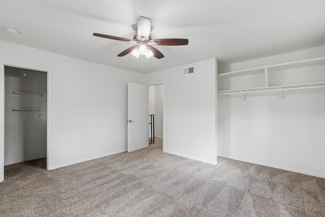 unfurnished bedroom featuring carpet and ceiling fan