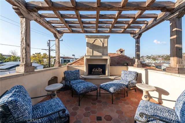 view of patio featuring an outdoor fireplace and a pergola