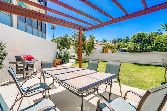 view of patio / terrace with outdoor dining space, fence, a pergola, and grilling area