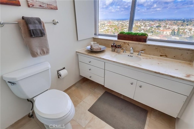 bathroom with toilet and vanity