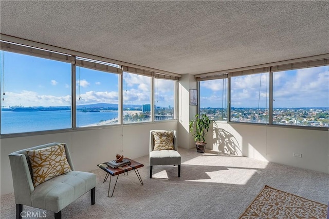 sunroom / solarium with a water view