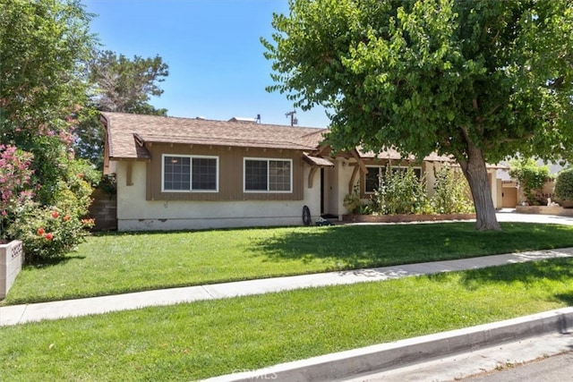 ranch-style home with a front yard