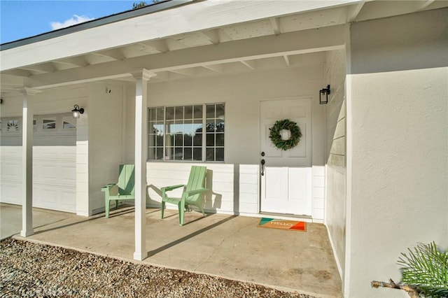 doorway to property featuring a garage