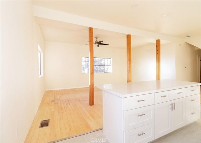 interior space featuring ceiling fan