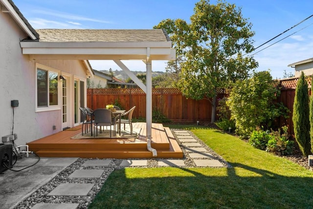 view of yard with a wooden deck