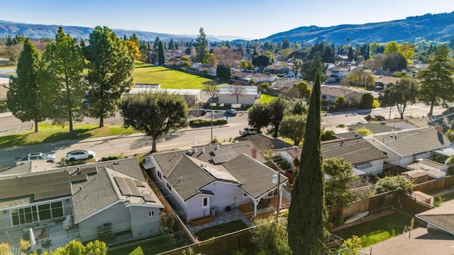 birds eye view of property with a mountain view