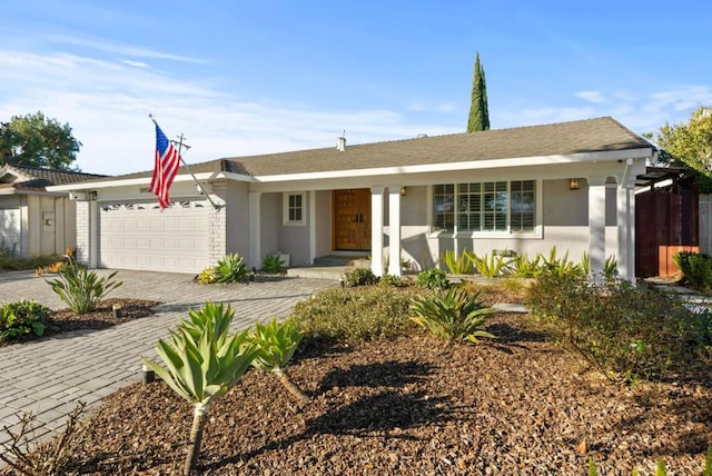 ranch-style home featuring a garage