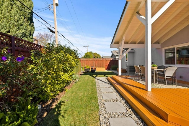 view of yard with a patio and central air condition unit