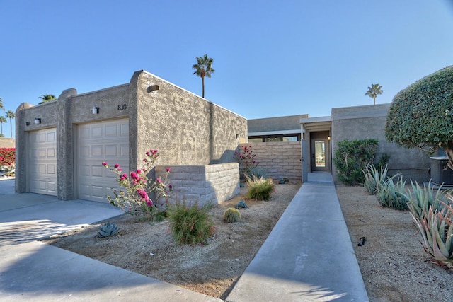 southwest-style home featuring a garage