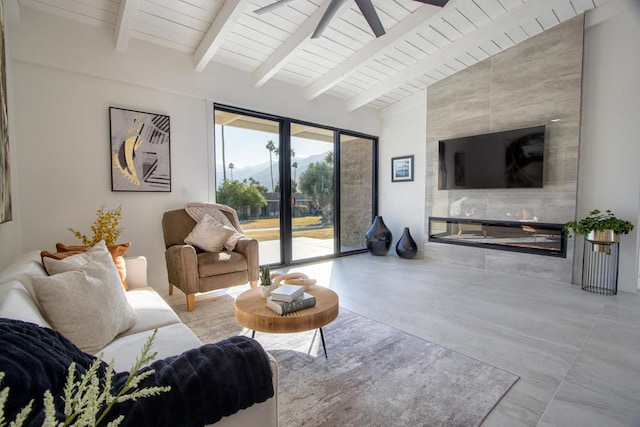 living room featuring ceiling fan, vaulted ceiling with beams, and wood ceiling