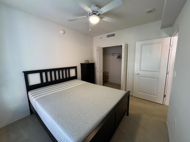 bedroom featuring a closet, ceiling fan, and carpet flooring