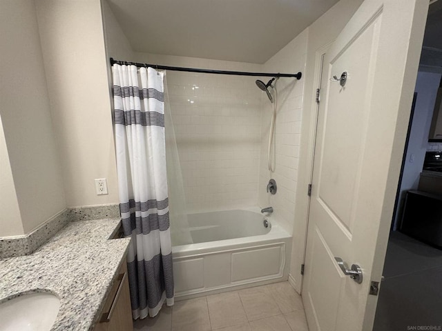 bathroom with shower / tub combo with curtain, tile patterned floors, and vanity