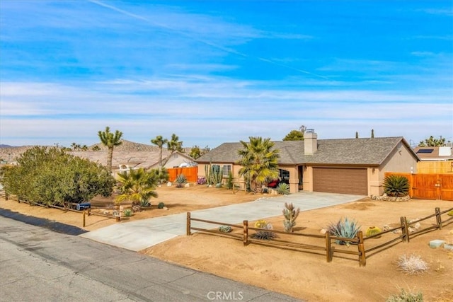 single story home featuring a garage