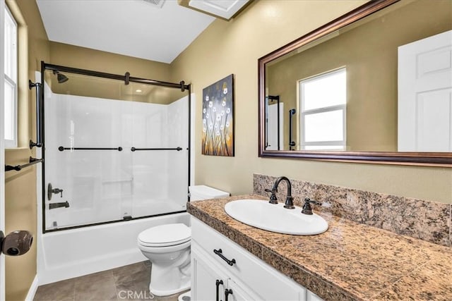 full bathroom featuring toilet, tile patterned floors, vanity, and shower / bath combination with glass door