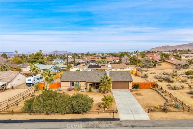 birds eye view of property with a mountain view