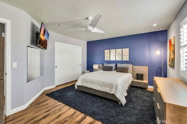 bedroom with hardwood / wood-style flooring and ceiling fan