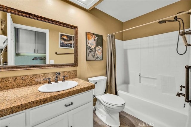 full bathroom with vanity, toilet, tile patterned flooring, and shower / bath combo with shower curtain