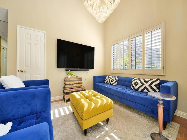 living room featuring hardwood / wood-style floors and a chandelier