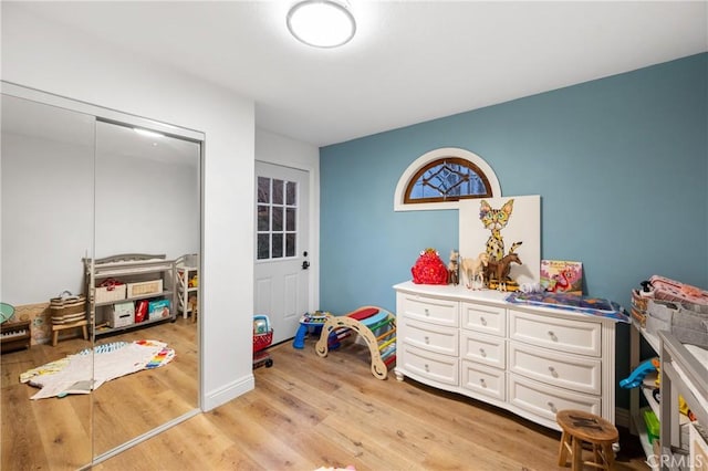 recreation room featuring light hardwood / wood-style floors