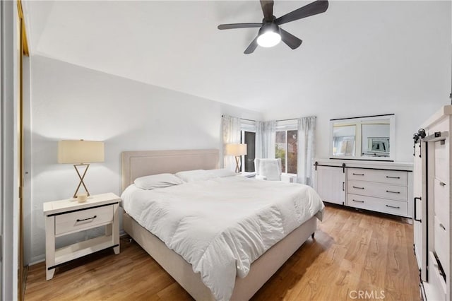 bedroom with ceiling fan and light wood-type flooring