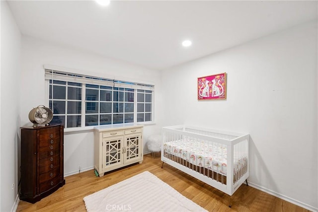 bedroom featuring hardwood / wood-style flooring