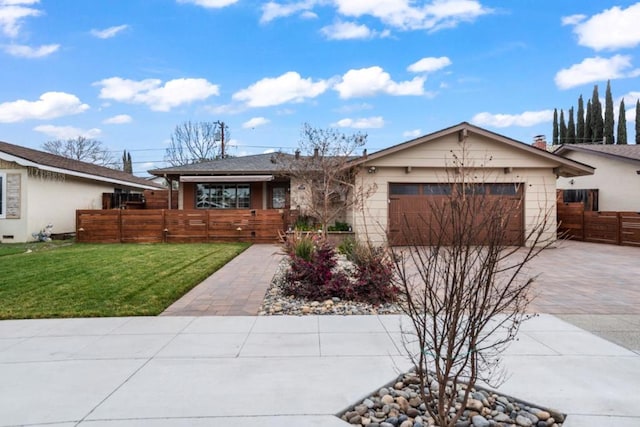 ranch-style home with a garage and a front yard