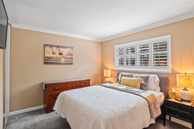 bedroom featuring ornamental molding and dark colored carpet