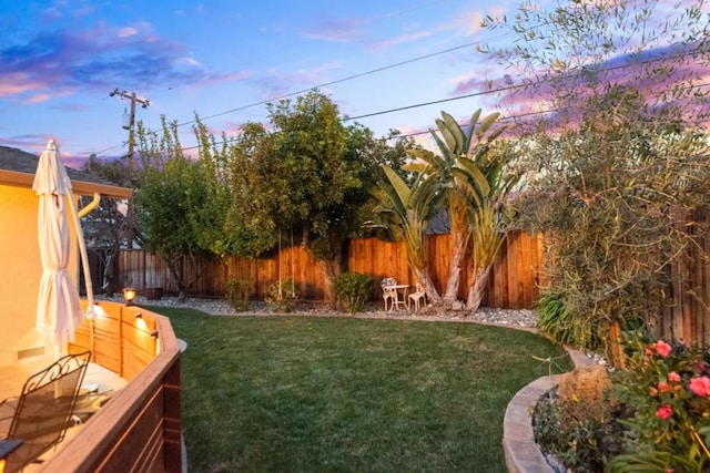 view of yard at dusk