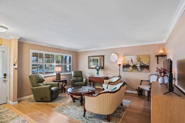 living room with ornamental molding and light wood-type flooring