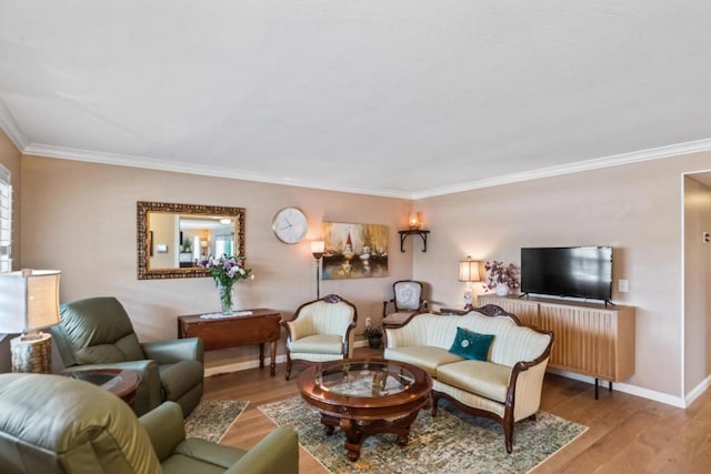 living room with wood-type flooring and ornamental molding