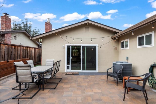 back of house featuring cooling unit and a patio