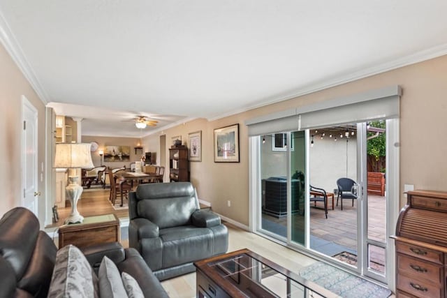 living room featuring ceiling fan and ornamental molding