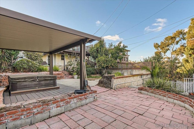 view of patio / terrace featuring a covered hot tub