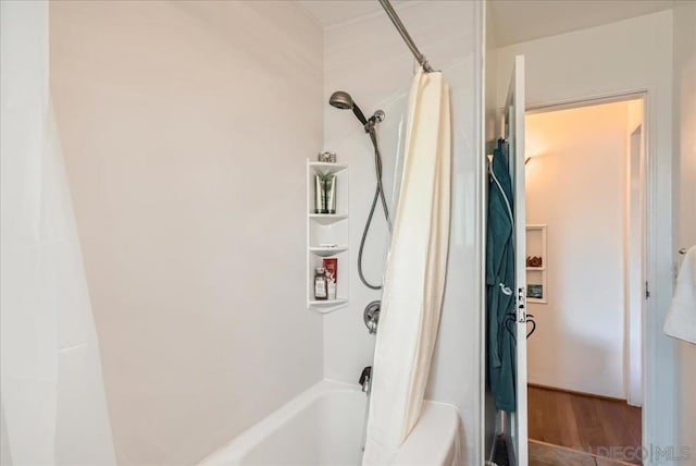 bathroom with shower / tub combo with curtain