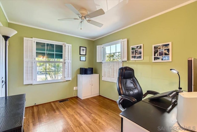 office area with ceiling fan, ornamental molding, and light hardwood / wood-style floors