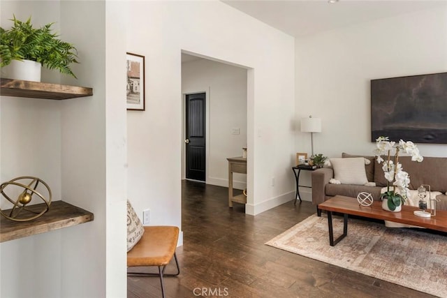 living room with dark hardwood / wood-style floors