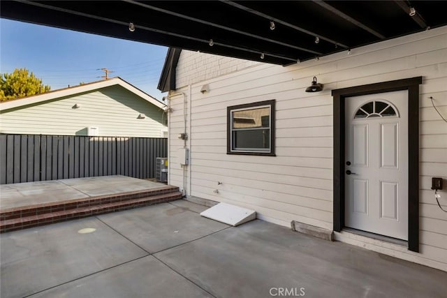 property entrance with a patio